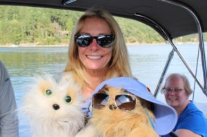 Students with plushes on a boat