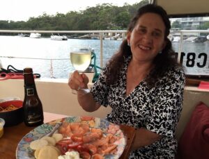 Lin Pardey enjoying a sundowner aboard yacht