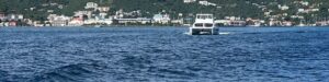 50' catamaran chartered from The Moorings seen in distance coming out of Road Town Harbor in the British Virgin Islands