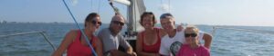 Family enjoying a sunny boat day
