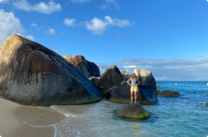 Man standing on a rock at The Caves in British Virgin Islands
