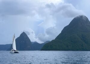 Catamaran sailboat sailing by the Pitons
