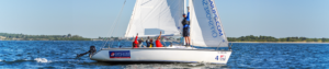 Offshore Sailing School Instructor and Students Sailing a Boat