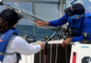 Student and instructor using the boom vang