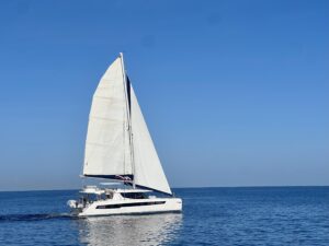 catamaran sailboat on blue water