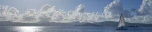 Sailboat with clouds behind it