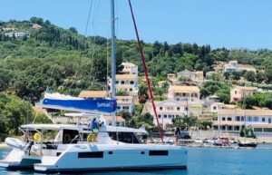 Catamaran sailboat sailing into Corfu Greece anchorage