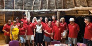 A group of sailors in red shirts in Bora Bora Tahiti